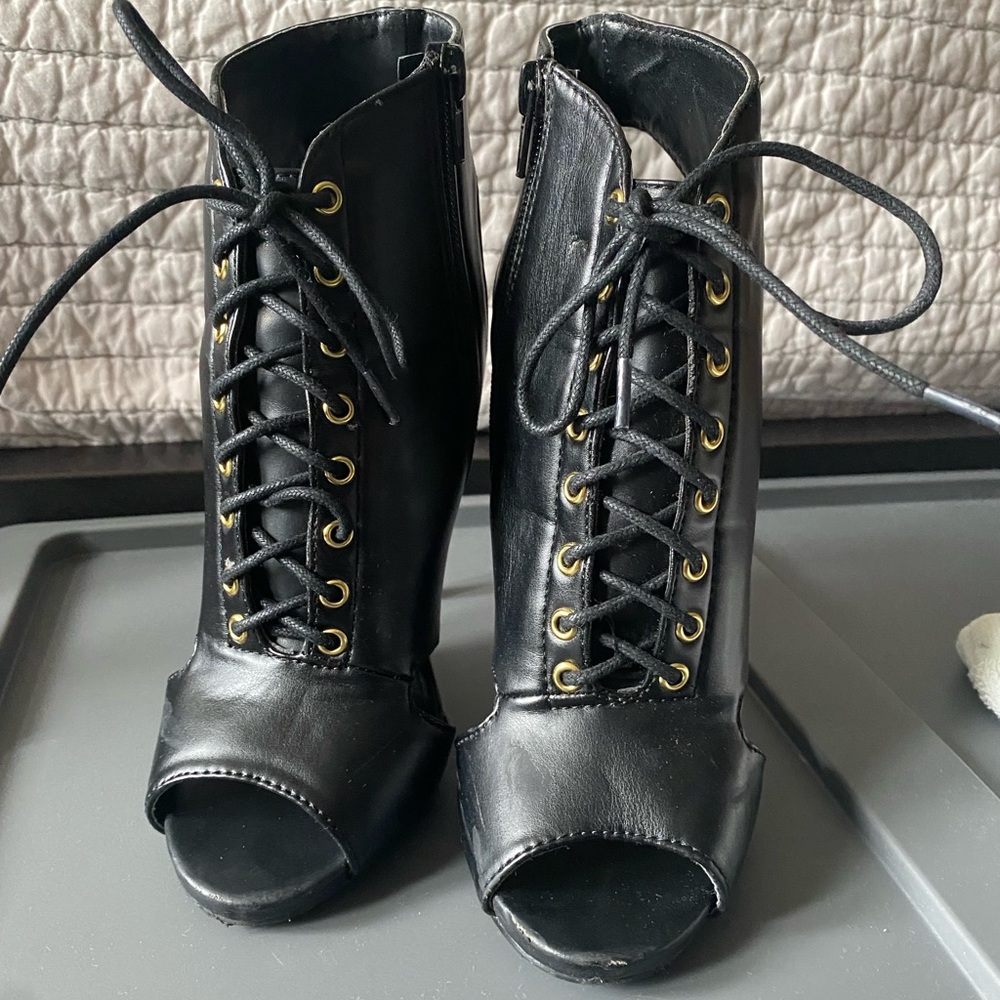 Charlotte Russe peep toe lace up heel booties. US 6